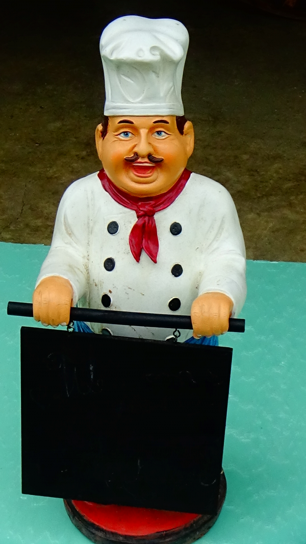Large statue of an Italian chef